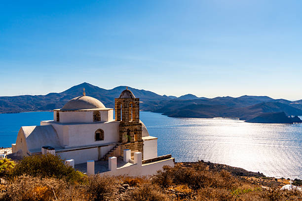 Panagia Thalassitra Church. Taken from the church on the top of the hill in Plaka village (Milos Island, Cyclades, Greece). Below the church of The Assumption of the Virgin Mary or Panaghia Skiniotissa and the church of Panaghia Thalassitra