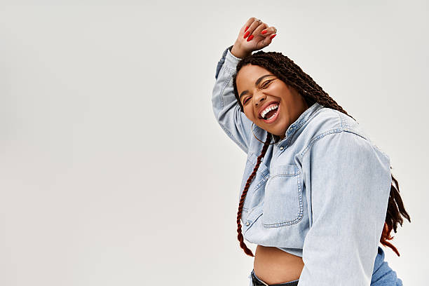 istock Joyful celebration of beauty in denim against a minimalistic grey backdrop 2221153560