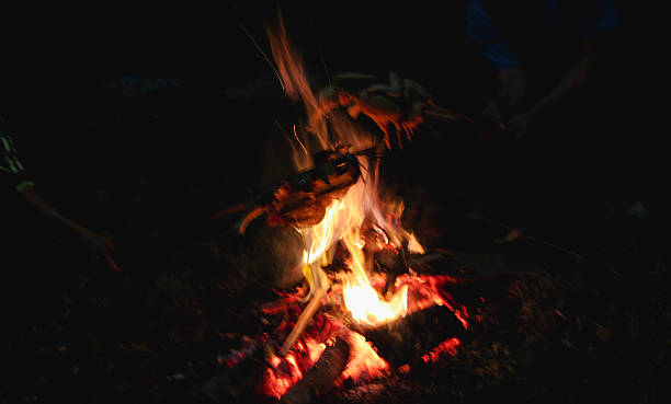 istock Outdoor Campfire Cooking Over Open Flames in a Night Rustic Setting 2221153856