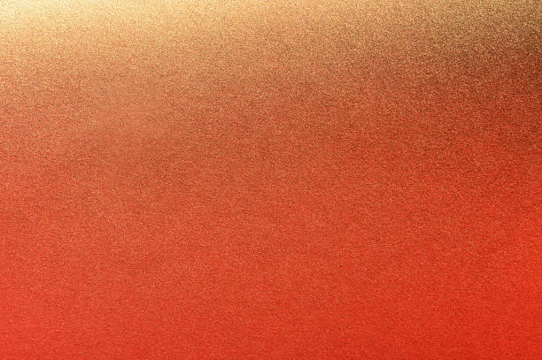 istock golden spray paint gradient on orange color paper 2221157004