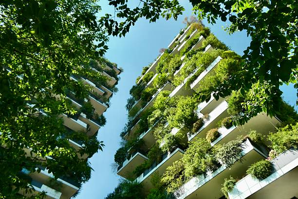 istock Skyscraper with trees on balconies with leaves in foreground 2221157026