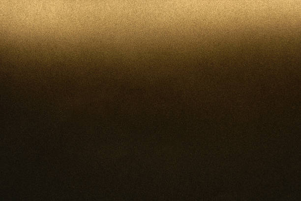 istock golden spray paint gradient on black color paper 2221157067