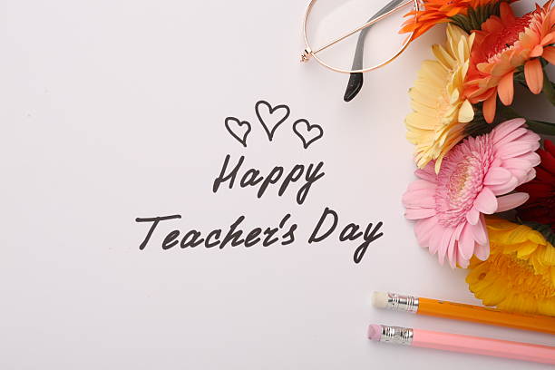 istock Teacher's Day celebration with students, gifts, and gratitude 2221163123