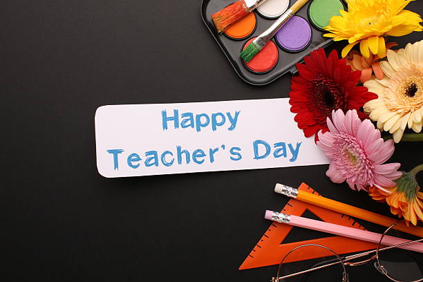 istock Teacher's Day celebration with students, gifts, and gratitude 2221163125