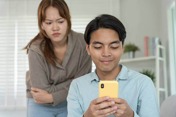 istock Double dating, husband use phone chat for somebody,, have a fling, Bit on the side , Commit adultery ,Polygamy, husband was having an affair. family problem, infidelity, divorce, separate 2221167536