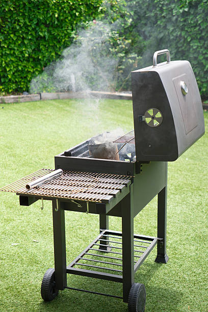 istock Smoking barbecue in a garden 2221169459