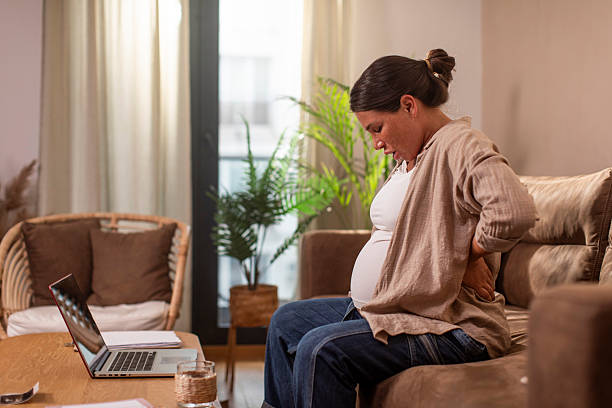 istock Pregnant woman having back pain 2221170163