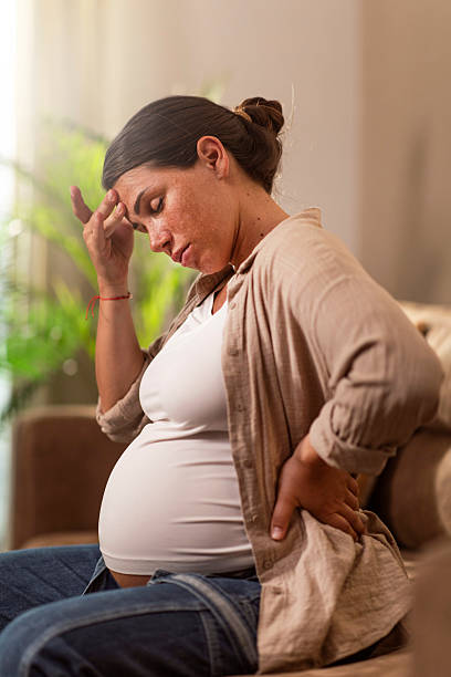 istock Pregnant woman having headache 2221170233