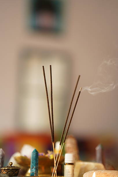 istock Composition with smoldering incense sticks and spa stones on blurred background 2221178448