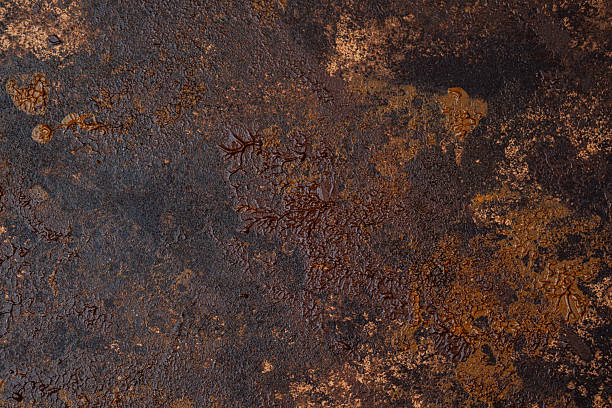 istock Rusty metal texture with rich brown and orange oxidation patterns 2221182493