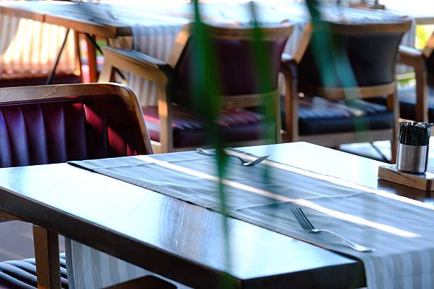 istock Waiters preparing the table for dinner service in a luxury restaurant. 2221184360