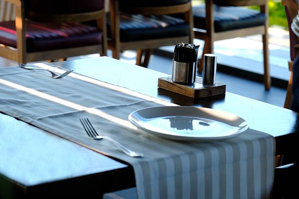 istock Waiters preparing the table for dinner service in a luxury restaurant. 2221184364