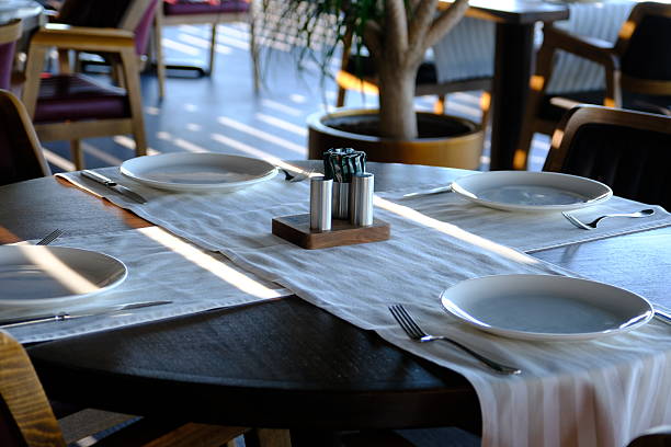 istock Waiters preparing the table for dinner service in a luxury restaurant. 2221186662