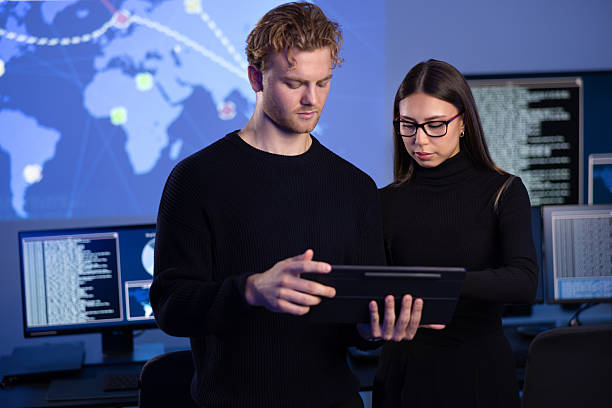 istock Focused professional cyber security team working to prevent security threats, find vulnerability and solve incidents 2221189906