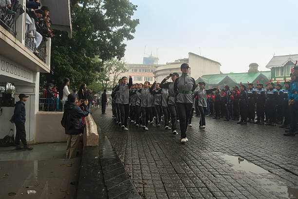 Darjeeling,West Bengal,India -11.08.2023 : Preparation of Independence Day celebration on 15th August 2023. School student cadets marching past at Darjeeling Mall, Military training. Foggy morning.