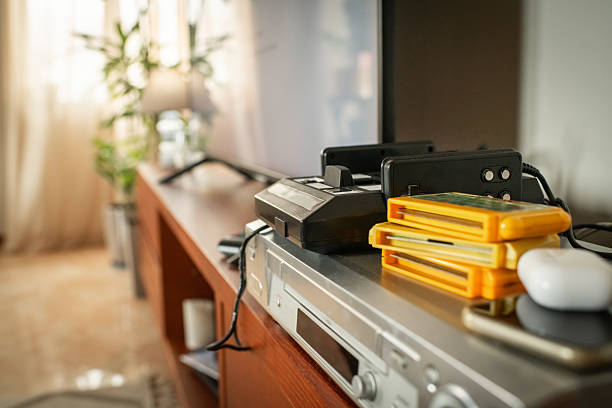 Home interior with retro game console, VCR player and modern LCD television