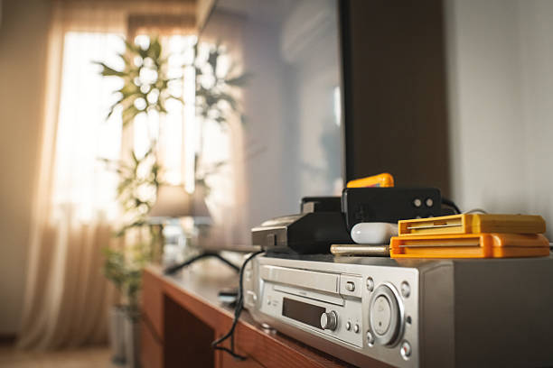 Home interior with retro game console, VCR player and modern LCD television
