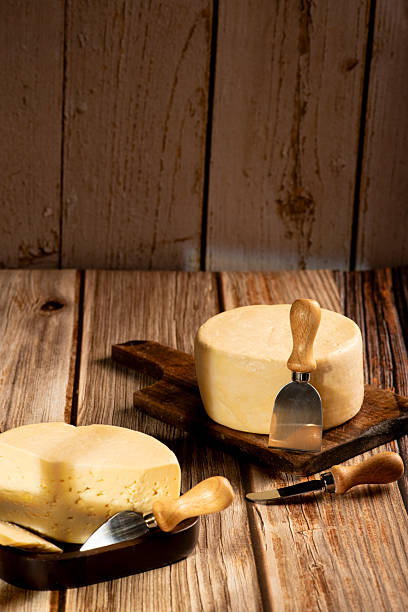 istock Minas Cheese, Delicious semi-cured cheese from Minas Gerais, Brazil, on rustic wood, selective focus. 2221197287
