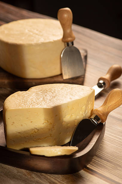 istock Minas Cheese, Delicious semi-cured cheese from Minas Gerais, Brazil, on rustic wood, selective focus. 2221197310