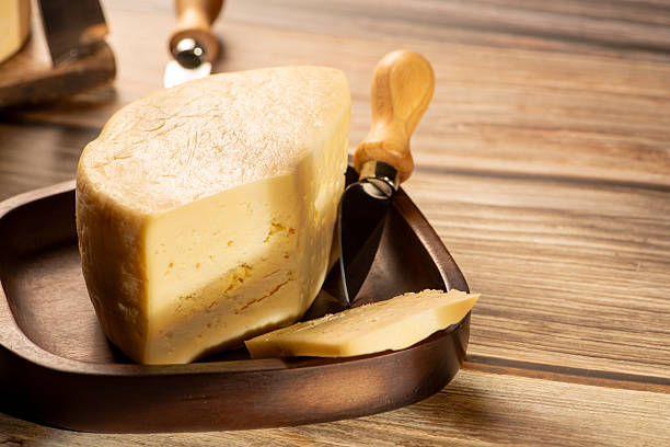 istock Minas Cheese, Delicious semi-cured cheese from Minas Gerais, Brazil, on rustic wood, selective focus. 2221197313