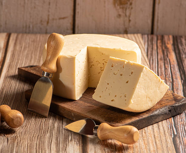 istock Minas Cheese, Delicious semi-cured cheese from Minas Gerais, Brazil, on rustic wood, selective focus. 2221197325