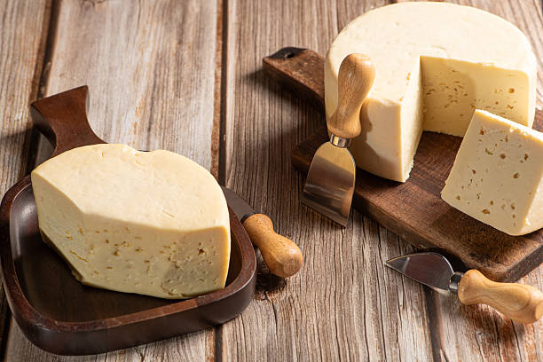 istock Minas Cheese, Delicious semi-cured cheese from Minas Gerais, Brazil, on rustic wood, selective focus. 2221197341