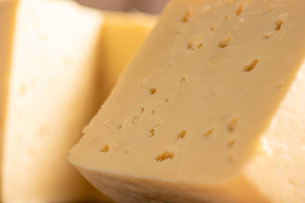 istock Minas Cheese, Delicious semi-cured cheese from Minas Gerais, Brazil, on rustic wood, selective focus. 2221197361