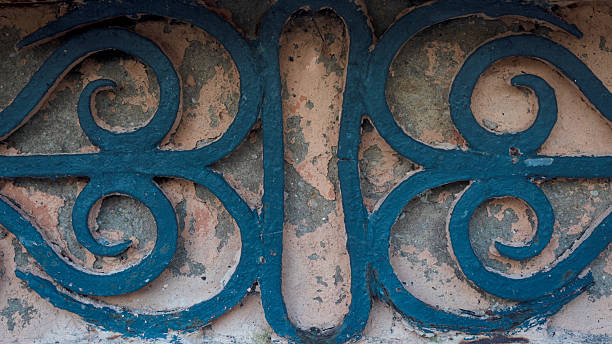 istock Light pink wall, old, with geometric design of old iron. Background for work, texture 2221200208
