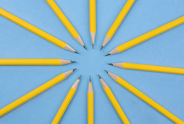 istock Yellow Pencils on Blue Background. Circular Layout. Stock photo. 2221203991