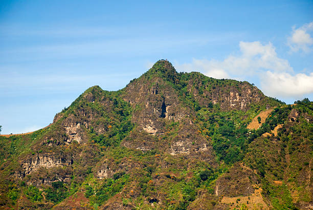 istock Dramatic Guatemalan mountain peak covered in lush vegetation under vibrant clear sky 2221205769