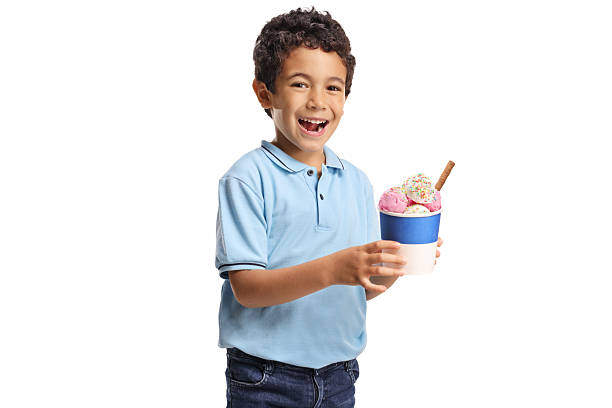 istock Boy holding an ice cream in a cup 2221210865