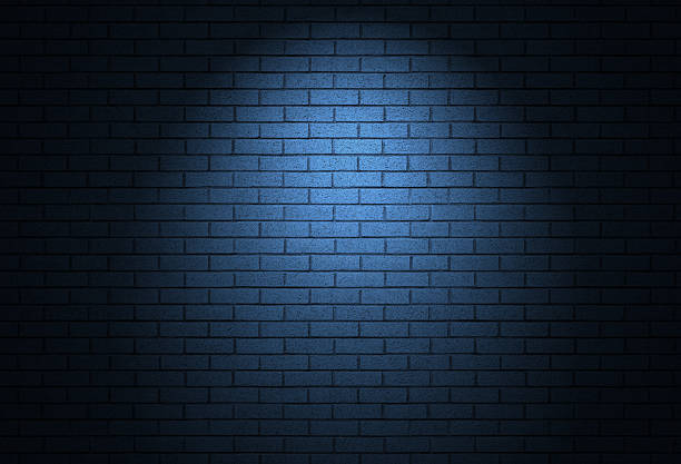 istock Night time street light on brick wall - dark alley background texture 2221211213
