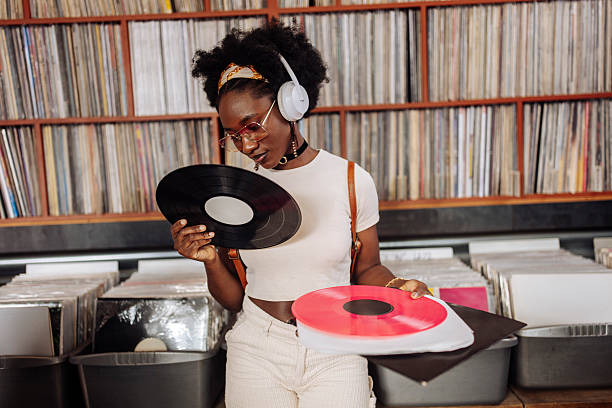 istock Stylish Black Woman Exploring Retro Vinyl Records 2221212207