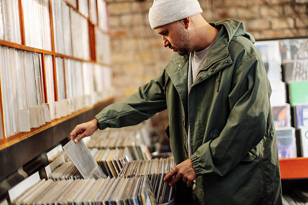 istock Side view of a man in vinyl record store 2221212331