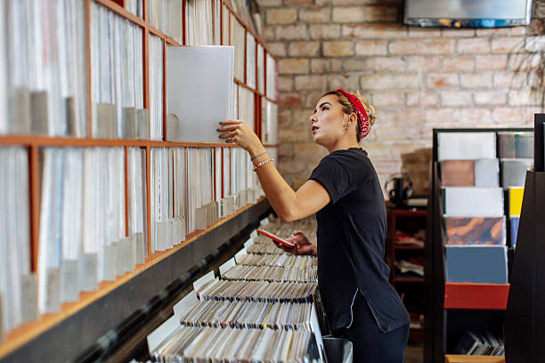 istock Woman Exploring Vinyl Records 2221212673