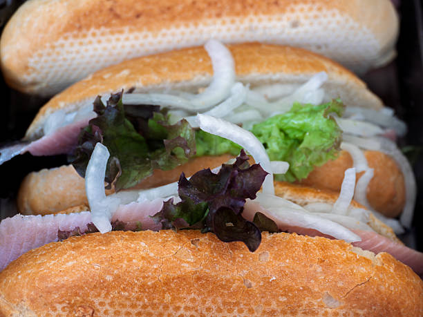 istock Delicious Ham and Lettuce Sandwiches on Fresh Buns 2221215286