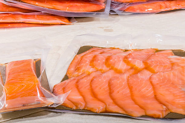 istock Red fish in a sealed vacuum plastic bag. Finished product from production 2221215530