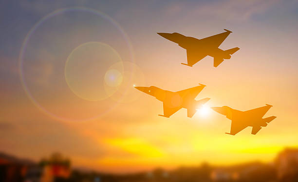 istock Fighter Jets Formation Silhouette Against Sunset Sky 2221216172