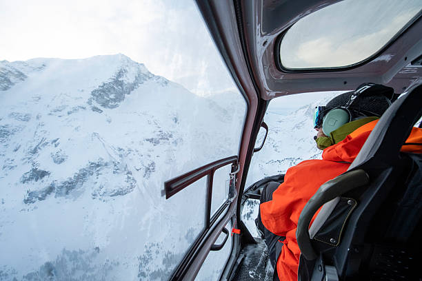 Passenger flies over mountains in helicopter