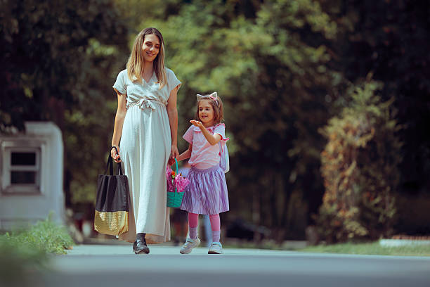 Mother and Daughter Going Back to School with a Flower Basket