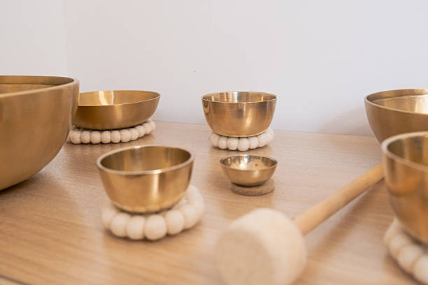 istock Tibetan Singing Bowls Set on Wooden Table 2221228156