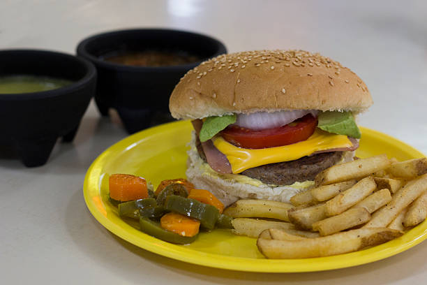 istock Delicious Burger with Fries and Side Dishes 2221231262