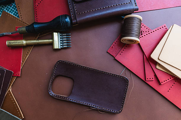 istock Craftmanship of genuine leather phone case handmade working 2221232053