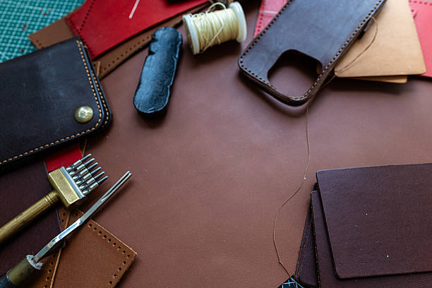 istock Craftmanship of genuine leather phone case handmade working 2221232528