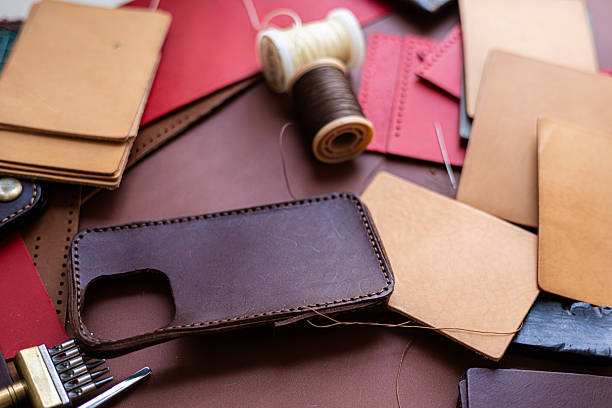 istock Craftmanship of genuine leather phone case handmade working 2221232827