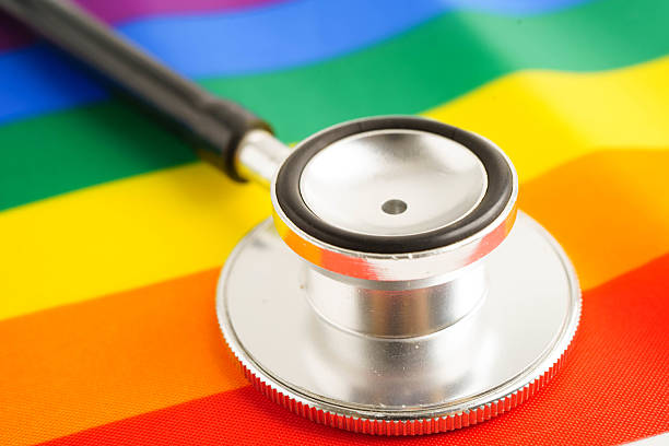 istock Stethoscope on LGBT rainbow flag, rights and gender equality. 2221240601