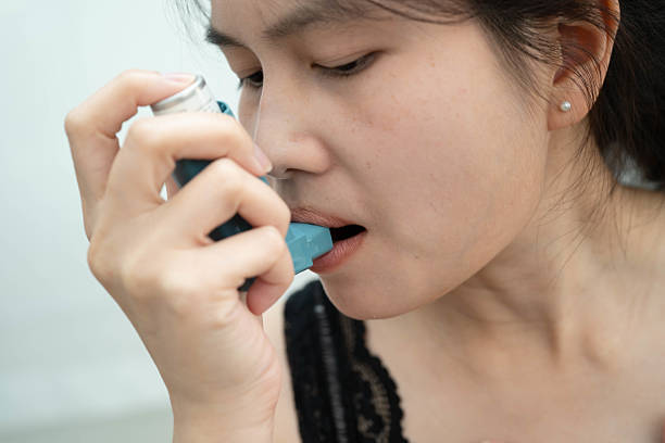 istock Asthma and chronic obstructive pulmonary disease COPD, Asian teenage using metered dose inhaler MDI. 2221246500