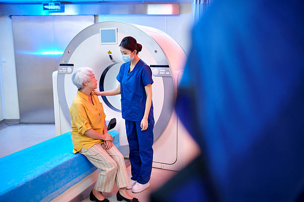 istock Female Nurse Communication & Talking to Patient 2221255011