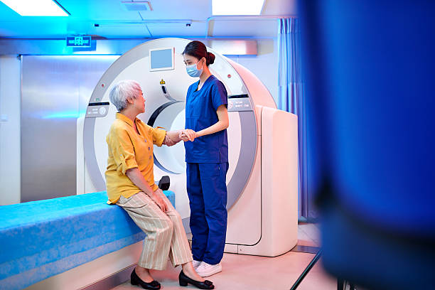 istock Female Nurse Communication & Talking to Patient 2221255015