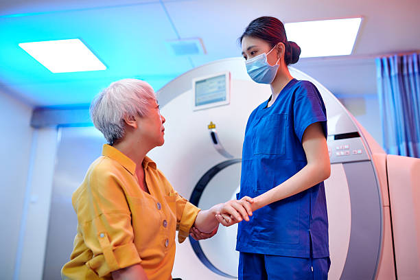 istock Female Nurse Communication & Talking to Patient 2221255018